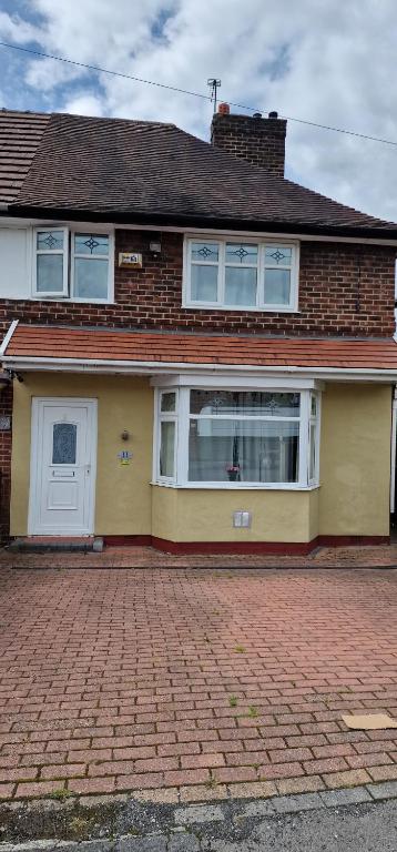 a house with a brick driveway in front of it at HESFORD (A) in Manchester