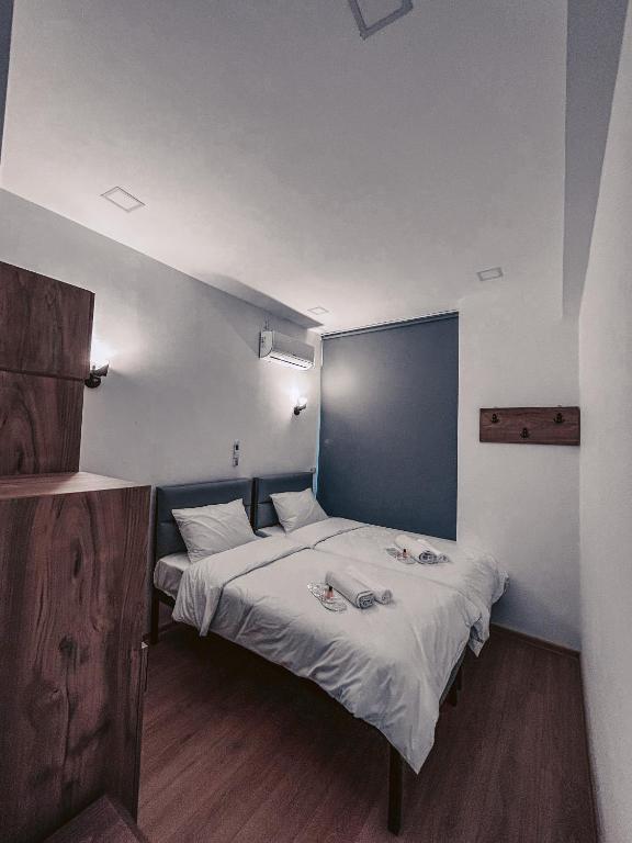 Postel nebo postele na pokoji v ubytování Apple cozy hotel