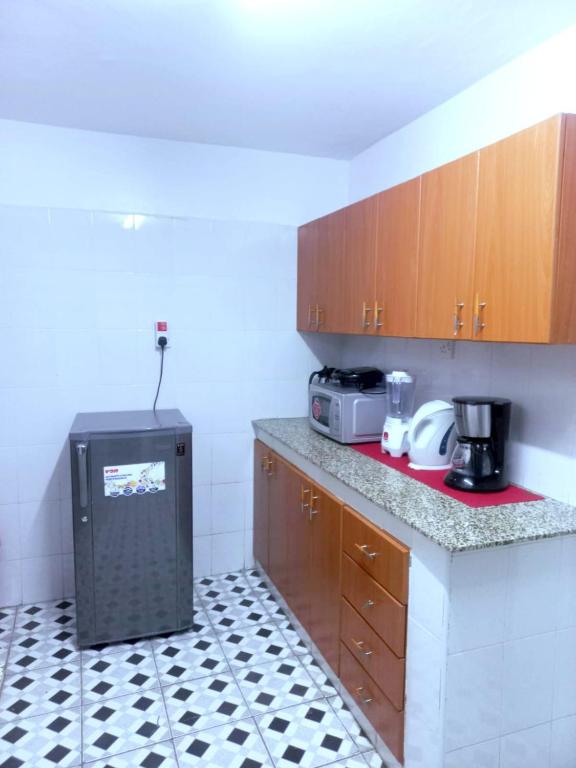 Kuchyň nebo kuchyňský kout v ubytování Jacky's Milimani suites