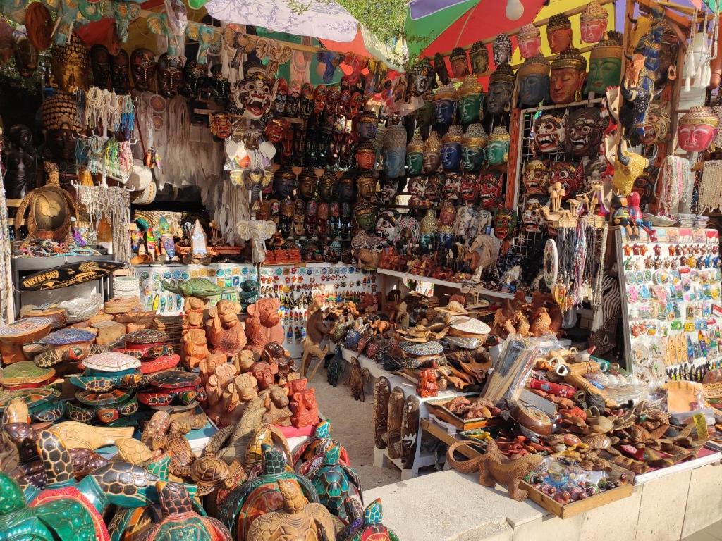 a market filled with lots of different types of items at Gili Mesari Cottages & Homestay in Gili Trawangan