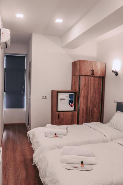 Postel nebo postele na pokoji v ubytování Apple cozy hotel