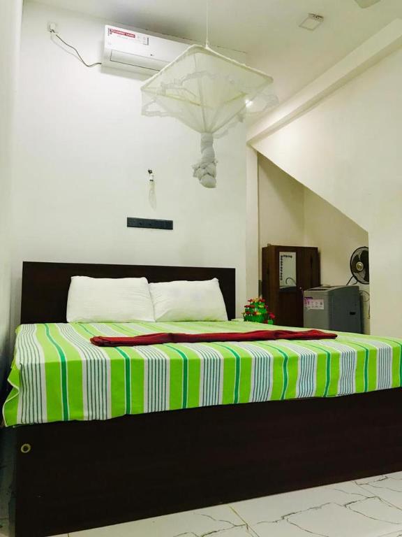 Postel nebo postele na pokoji v ubytování Green jade Inn Mirissa