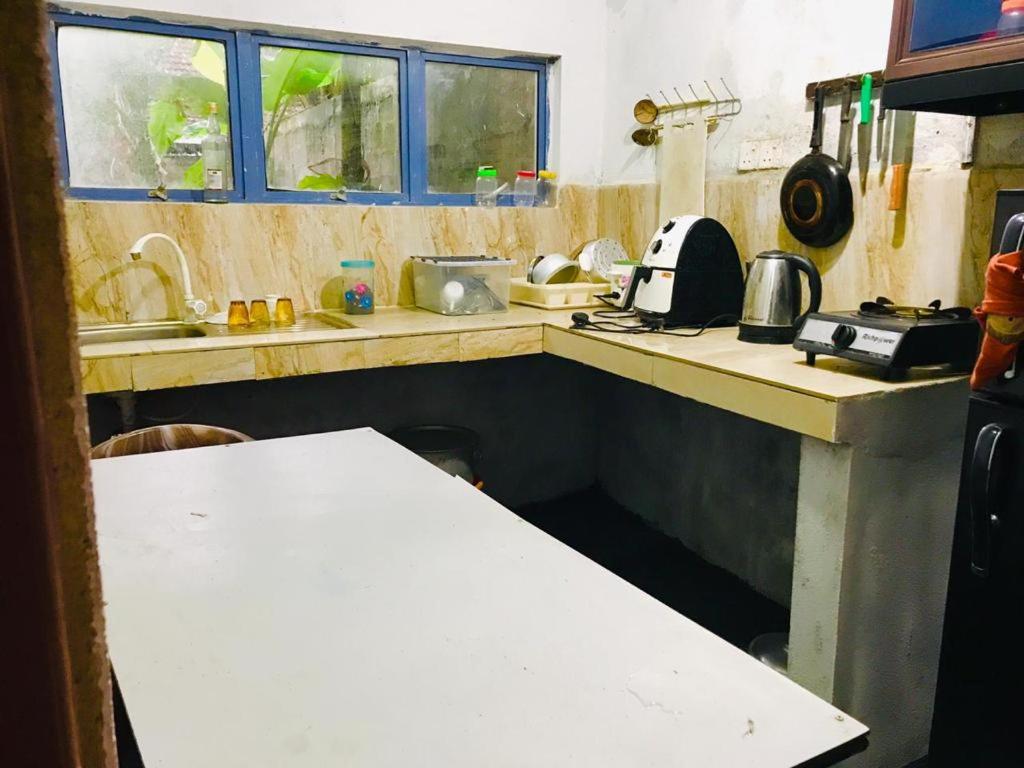 Kuchyň nebo kuchyňský kout v ubytování Green jade Inn Mirissa