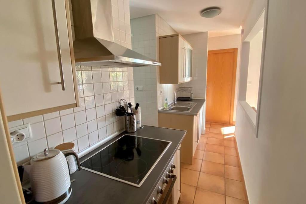 a kitchen with a sink and a counter top at Villa Alegre - 2 bed villa with private heated pool on Mar Menor Golf - family friendly in Torre-Pacheco