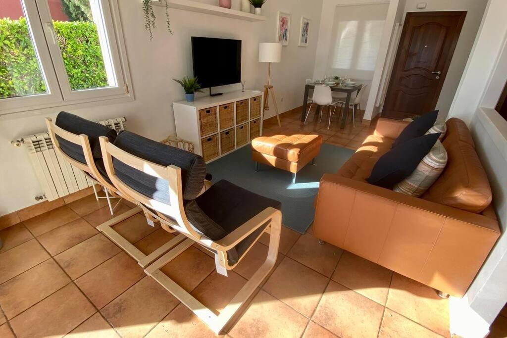 a living room with two chairs and a couch at Villa Alegre - 2 bed villa with private heated pool on Mar Menor Golf - family friendly in Torre-Pacheco