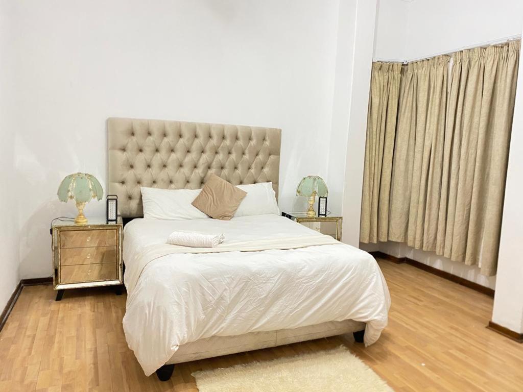 Postel nebo postele na pokoji v ubytování Tuscany Guesthouse