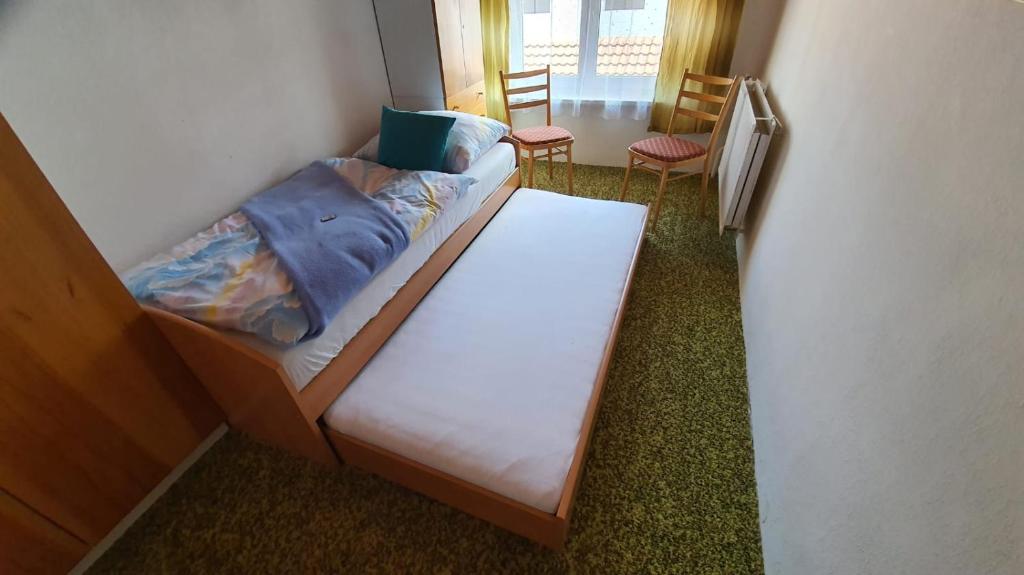 Postel nebo postele na pokoji v ubytování Retrohaus