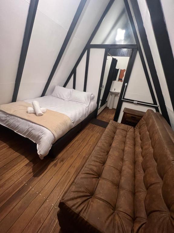 Postel nebo postele na pokoji v ubytování Villa Minta Cabañas