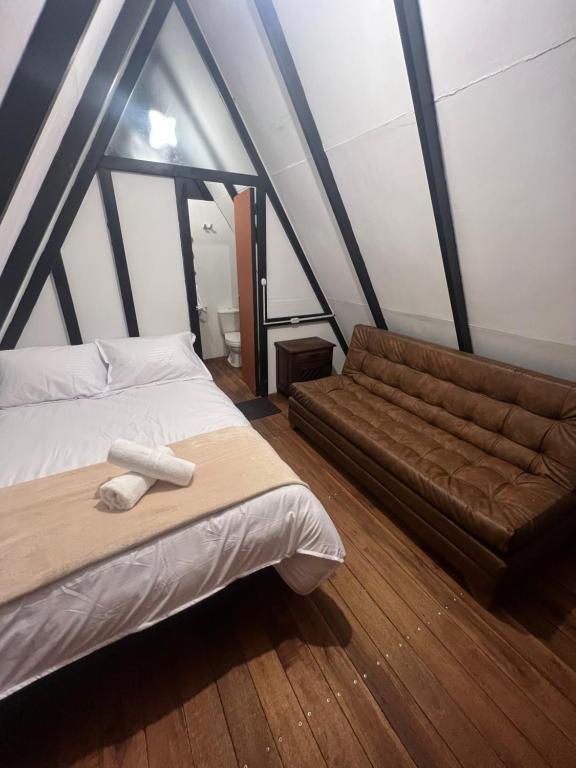 Postel nebo postele na pokoji v ubytování Villa Minta Cabañas
