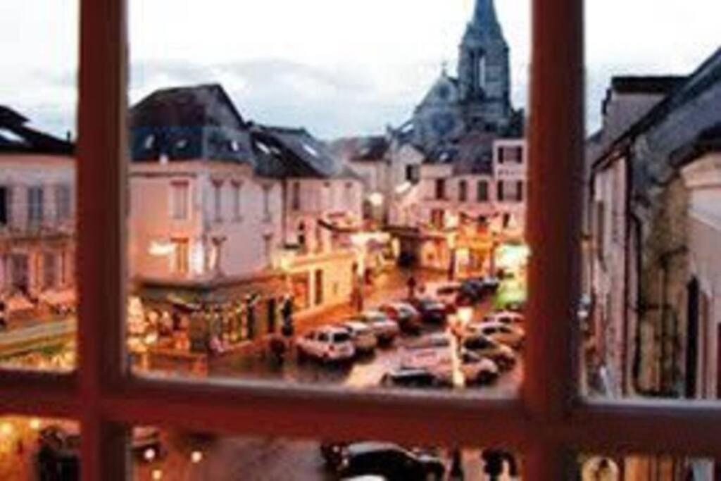 a view of a city street from a window at Petite maison de ville au calme in Brie-Comte-Robert