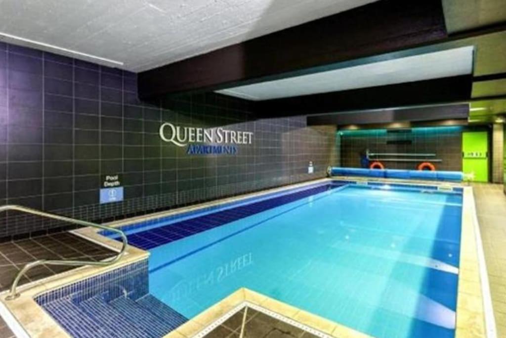 a large swimming pool in a building at Leicester City Center - Sauna Pool Gym in Leicester