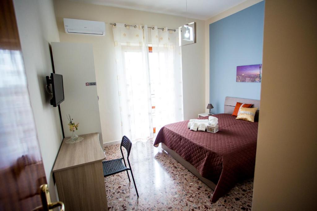 Postel nebo postele na pokoji v ubytování B&B L'Aurora CAPUA