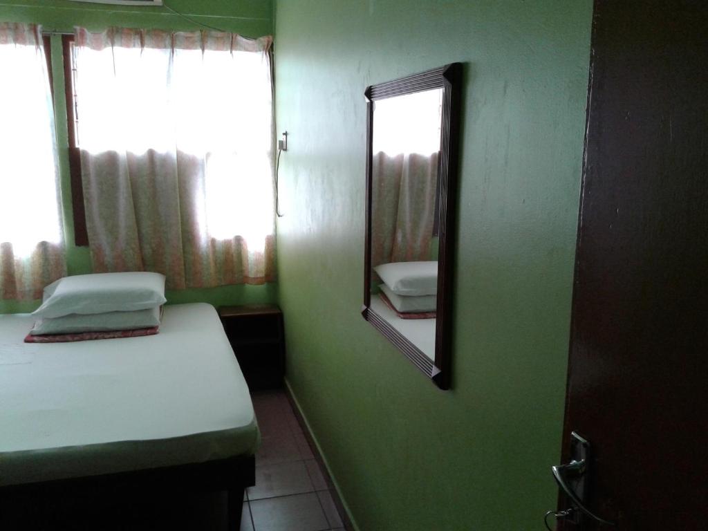 Postel nebo postele na pokoji v ubytování HotelMalaya