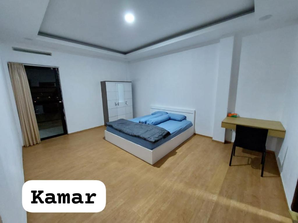 Tempat tidur dalam kamar di Villa anugerah hill