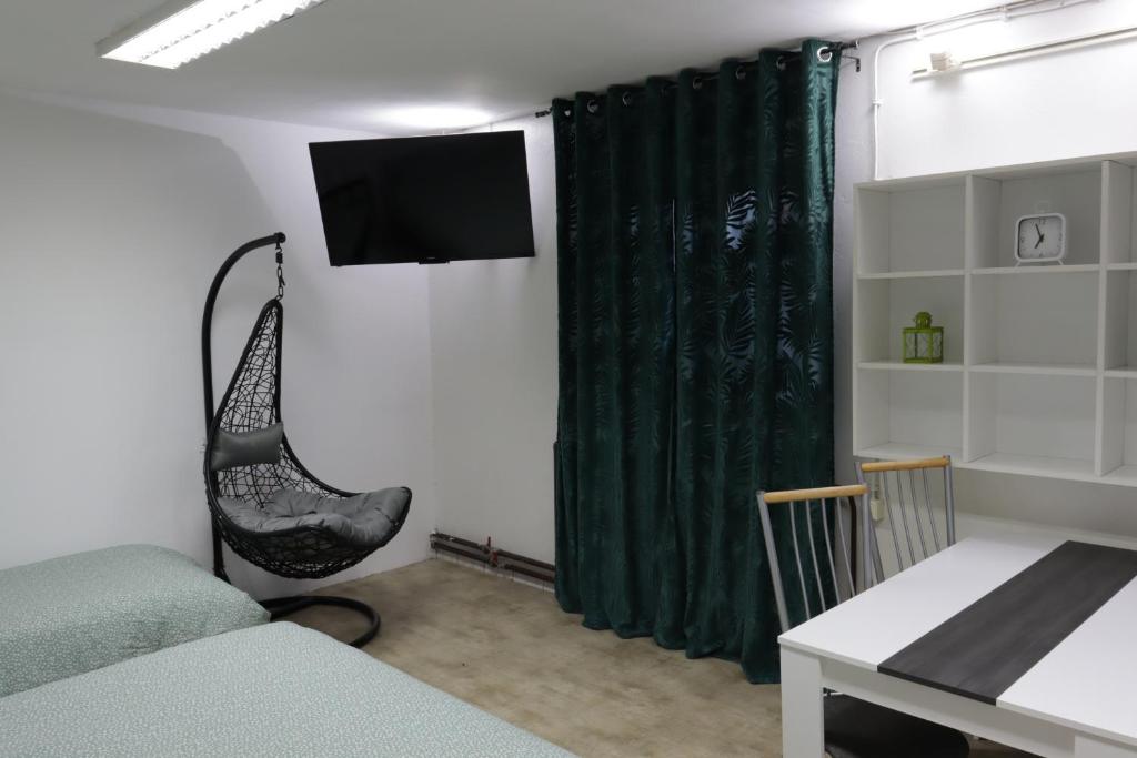 TV a/nebo společenská místnost v ubytování STUDIO STUDIO +