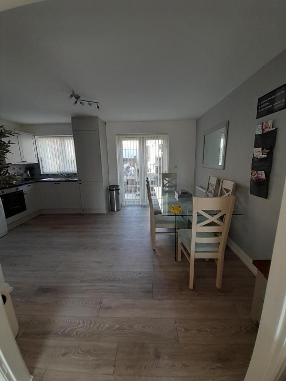 a kitchen and dining room with a table and chairs at Church House in Gainsborough
