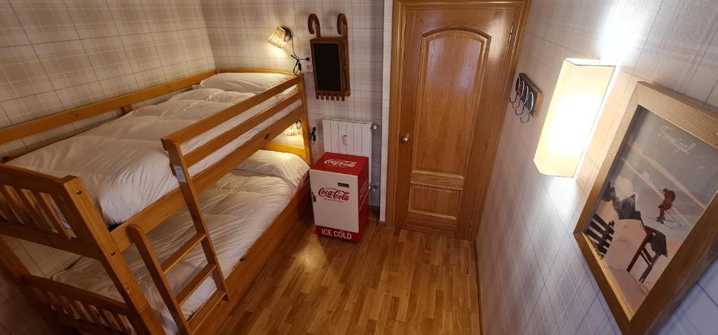 Postel nebo postele na pokoji v ubytování Salamandra Panticosa