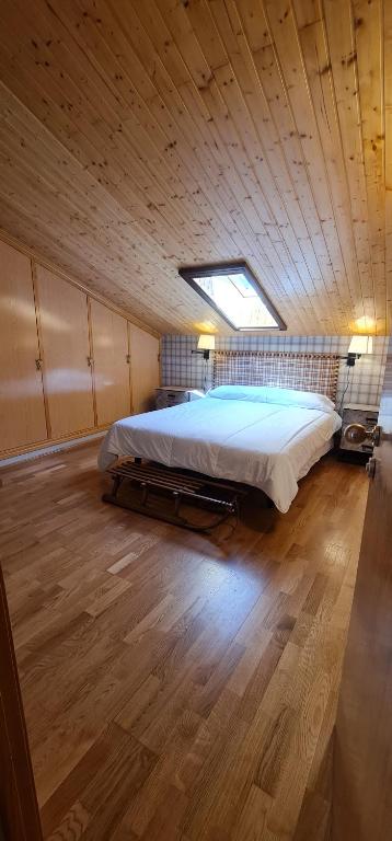 Postel nebo postele na pokoji v ubytování Salamandra Panticosa