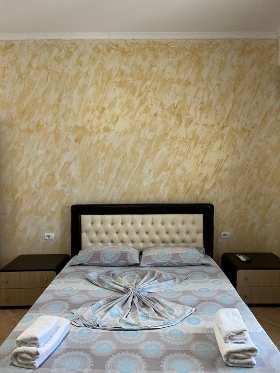 Llit o llits en una habitació de Hotel Frida