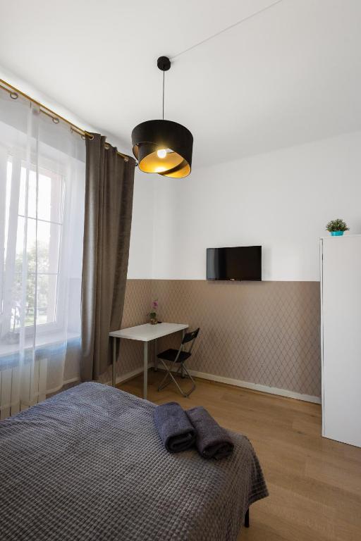 Posteľ alebo postele v izbe v ubytovaní ClickTheFlat Aleje Niepodległości Center Apart Rooms