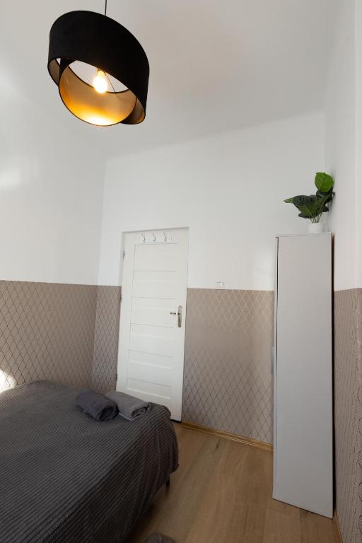 Posteľ alebo postele v izbe v ubytovaní ClickTheFlat Aleje Niepodległości Center Apart Rooms