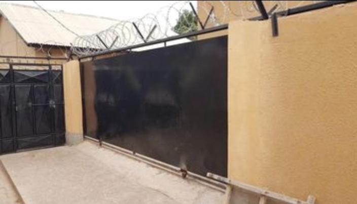 a large black screen on the side of a building at Annex House For Rent in Manjai Kunda