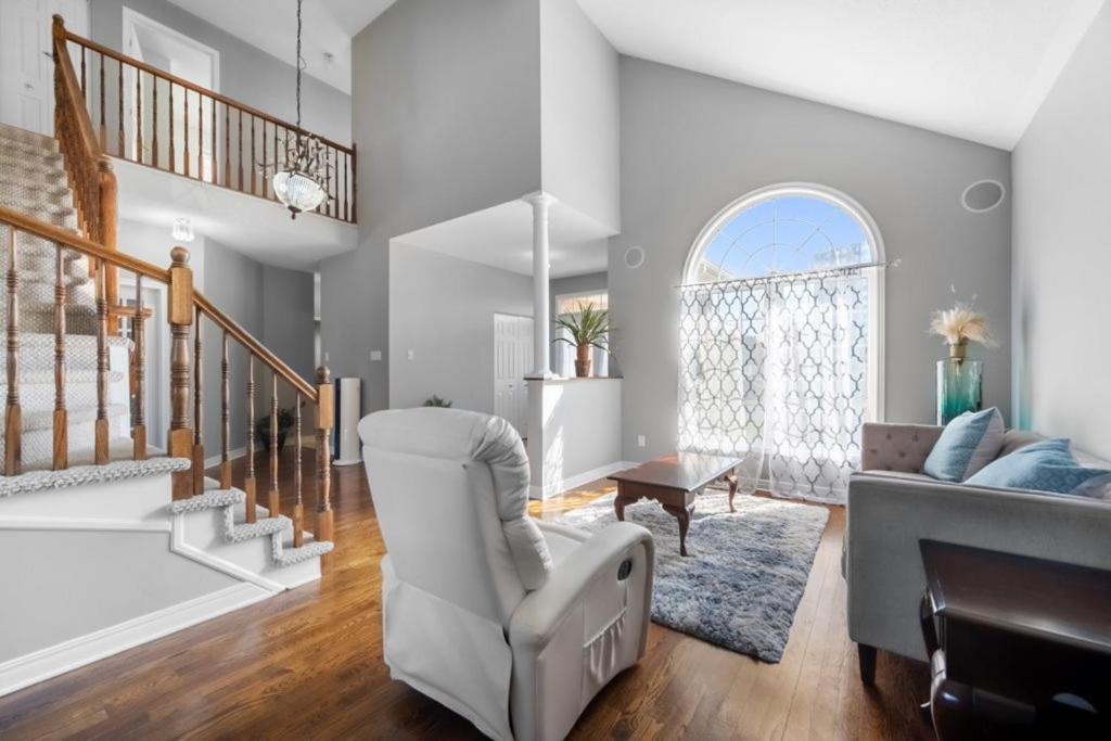 a living room with a chair and a couch at The house in Ottawa