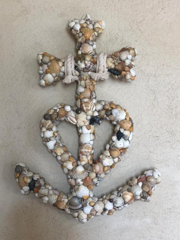 a pile of shells in the shape of a heart at Maison au bord de mer in Saintes-Maries-de-la-Mer