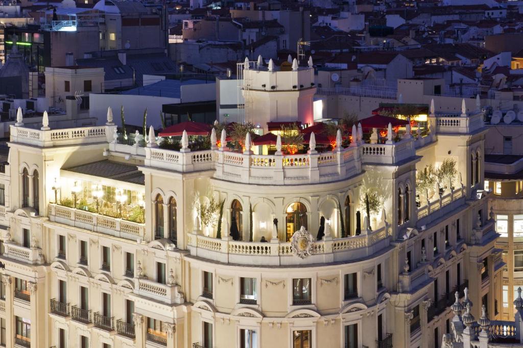 a view of a building at night at The Principal Madrid, Small Luxury Hotels in Madrid
