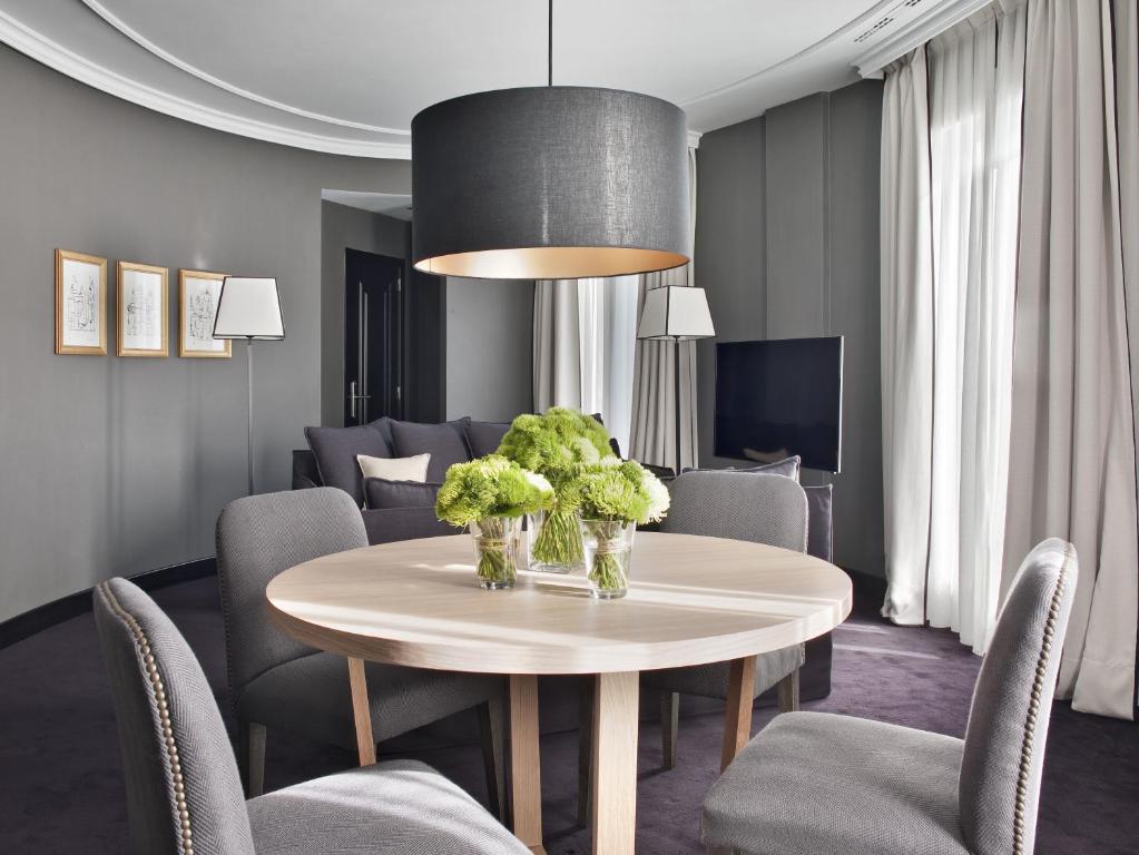 a dining room with a table and chairs at The Principal Madrid, Small Luxury Hotels in Madrid