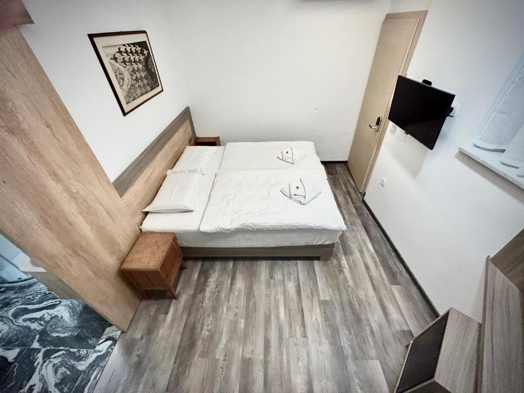 Postel nebo postele na pokoji v ubytování OH Apartments & Rooms