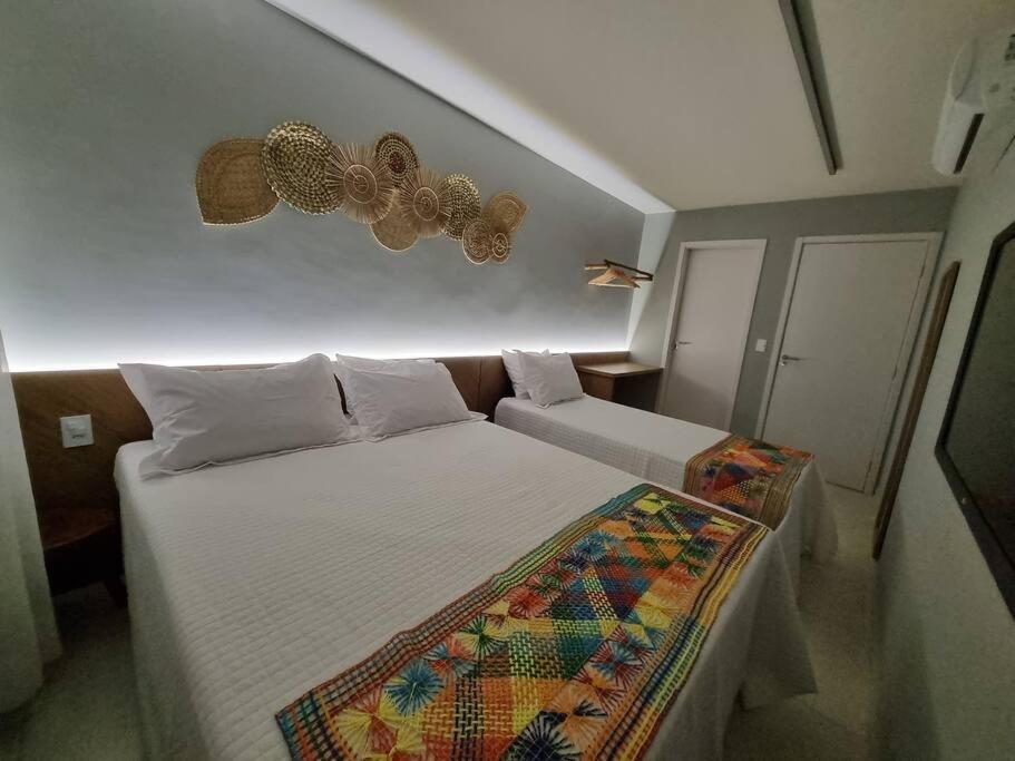 a bedroom with two beds in a room at Kanui Milagres 112 in São Miguel dos Milagres