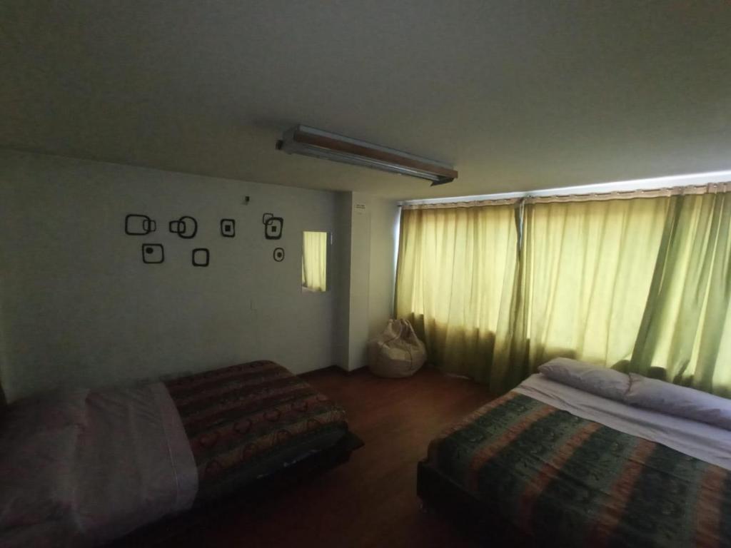Postel nebo postele na pokoji v ubytování North House Hostel