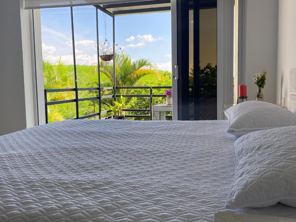 Postel nebo postele na pokoji v ubytování Hotel Casa Natura
