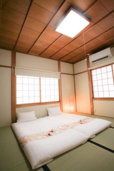 Postel nebo postele na pokoji v ubytování 飛騨高山　一の心