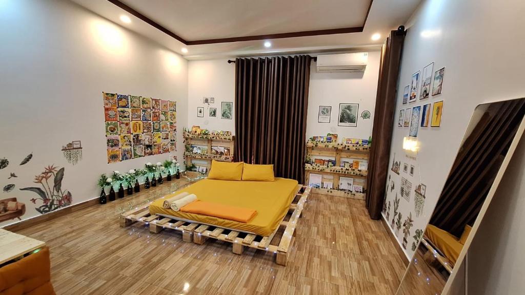 a childrens room with a bed and a book shelf at Mihome in Hai Phong