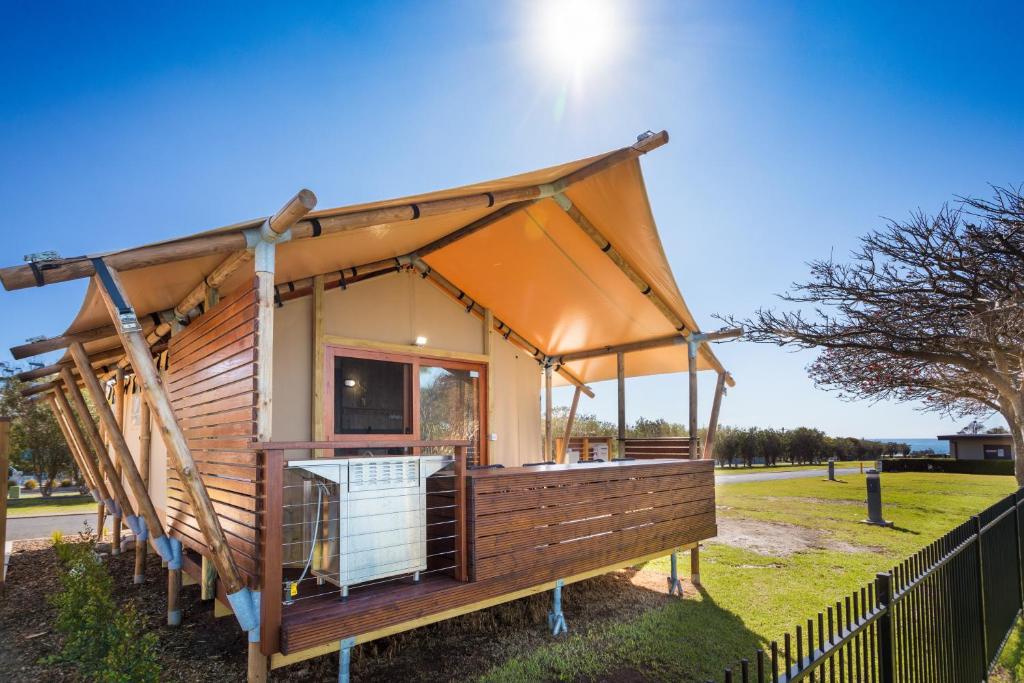 a tiny house with a large roof at NRMA Merimbula Beach Holiday Resort in Merimbula