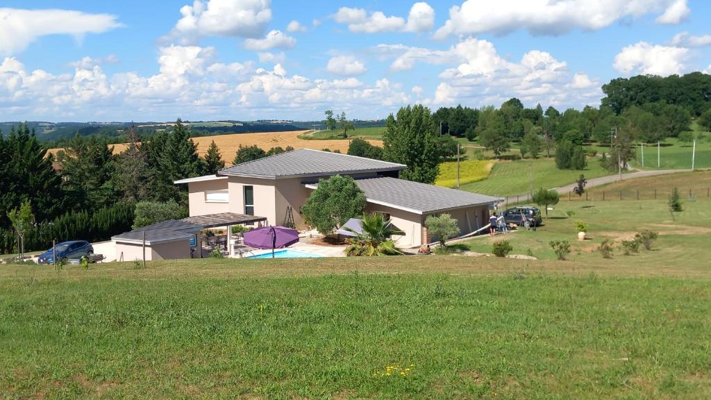 an aerial view of a house in a field at Millésime in Perville