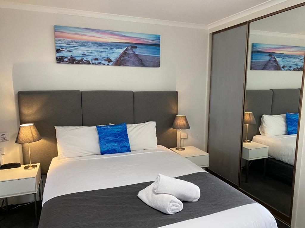 Postel nebo postele na pokoji v ubytování Frankston Motel