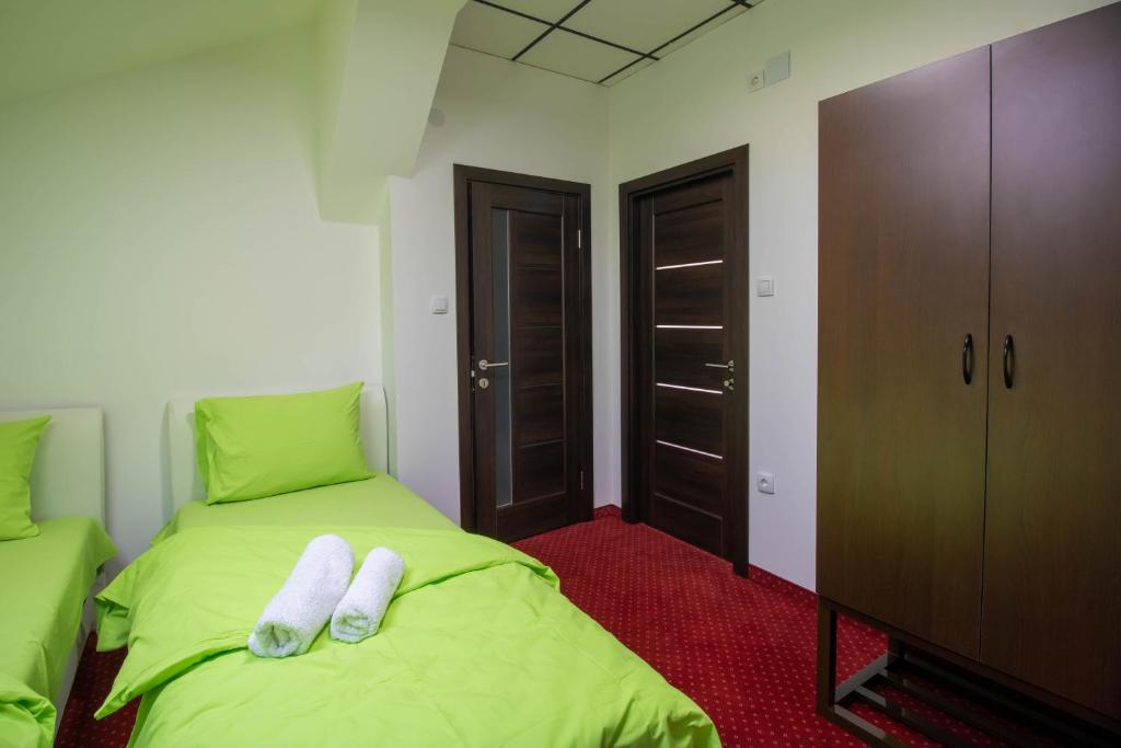 Postel nebo postele na pokoji v ubytování Hostel Aurora