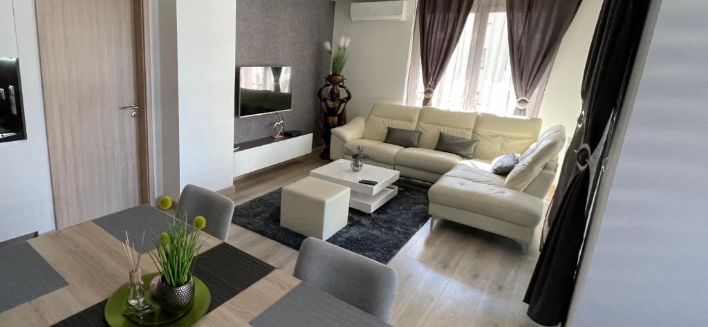 a living room with a couch and a table at N.Cristian Apartment in Budapest