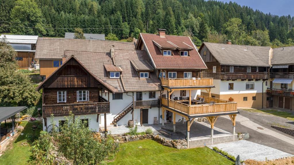 an aerial view of a large house in the mountains at Gailtal Appartements Nähe Skigebiet in Wertschach