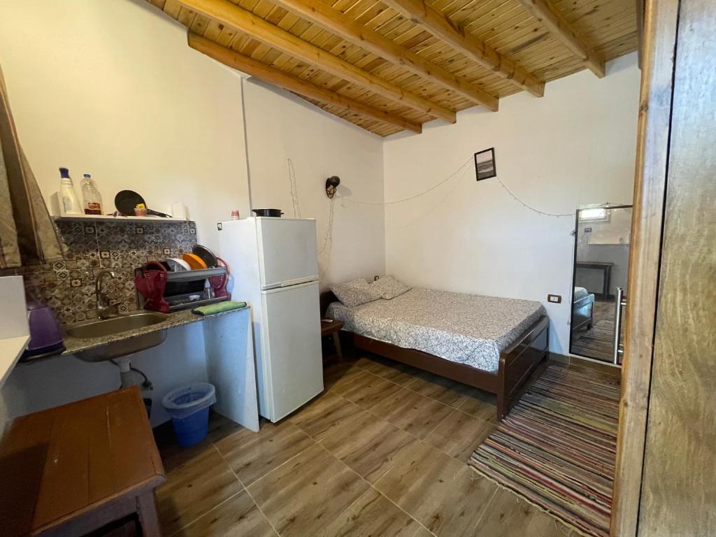 Postel nebo postele na pokoji v ubytování Nona’s House