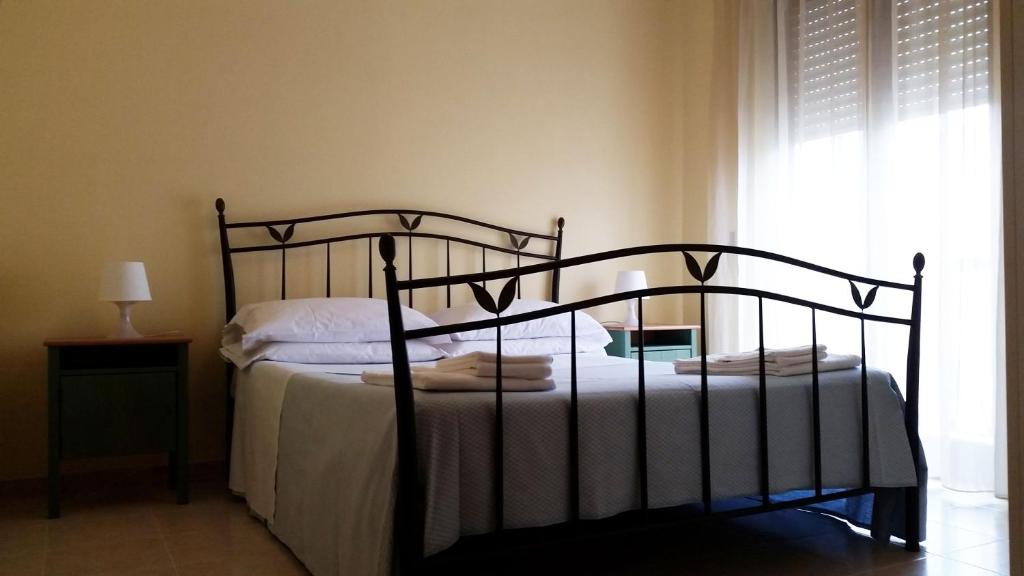Postel nebo postele na pokoji v ubytování Ciao Hotel & Residence - Apartments