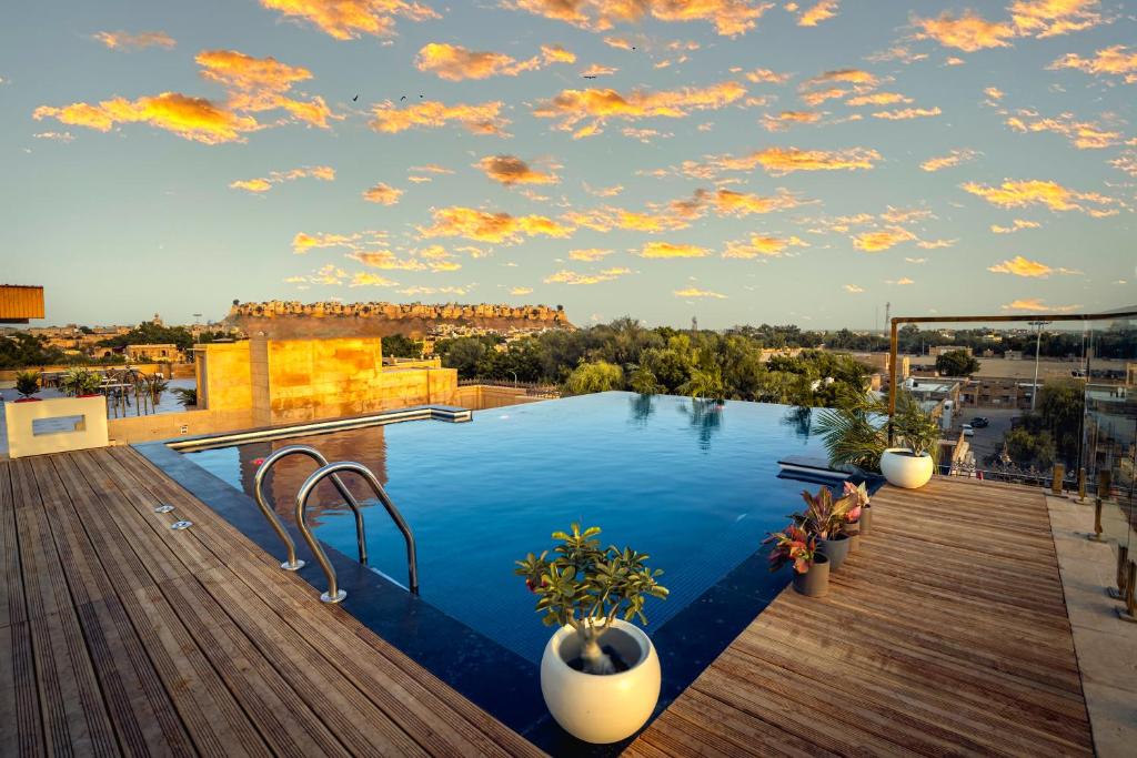 a swimming pool on the roof of a building at Rupal Residency in Jaisalmer