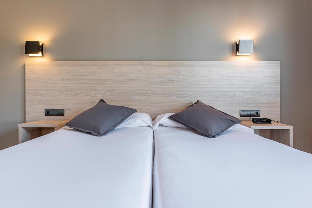 Postel nebo postele na pokoji v ubytování Hotel Air Penedès