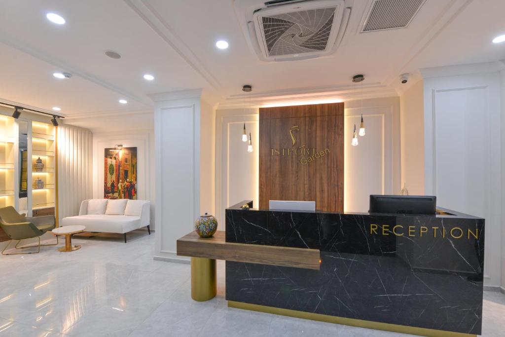 a lobby with a reception desk in a building at İSTPORT GARDEN HOTELS in Arnavutköy