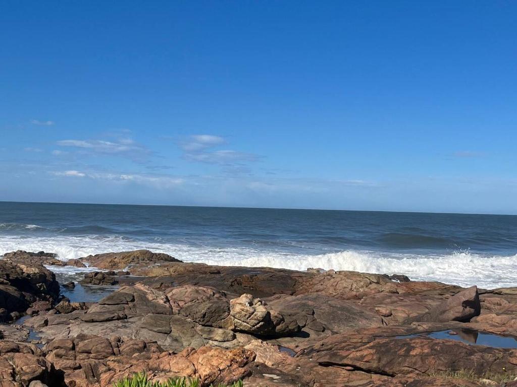 a view of the ocean from a rocky beach at Nomads Nook 7 Sea view 6 Sleeper in Margate