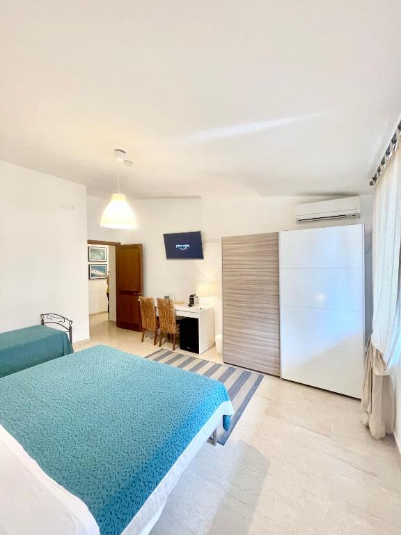 Postel nebo postele na pokoji v ubytování B&B Le Saline