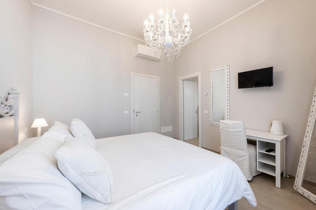 Postel nebo postele na pokoji v ubytování B&B De I Bravi